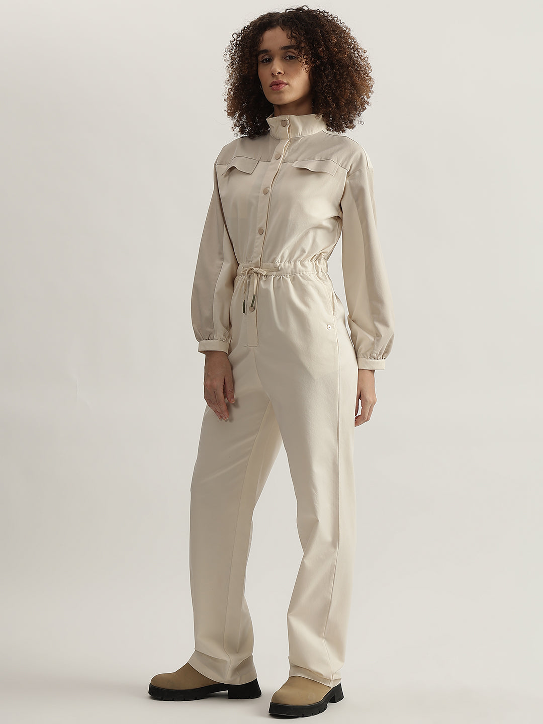 Iconic Women Beige Solid High Neck Full Sleeves Jumpsuit