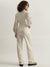 Iconic Women Beige Solid High Neck Full Sleeves Jumpsuit