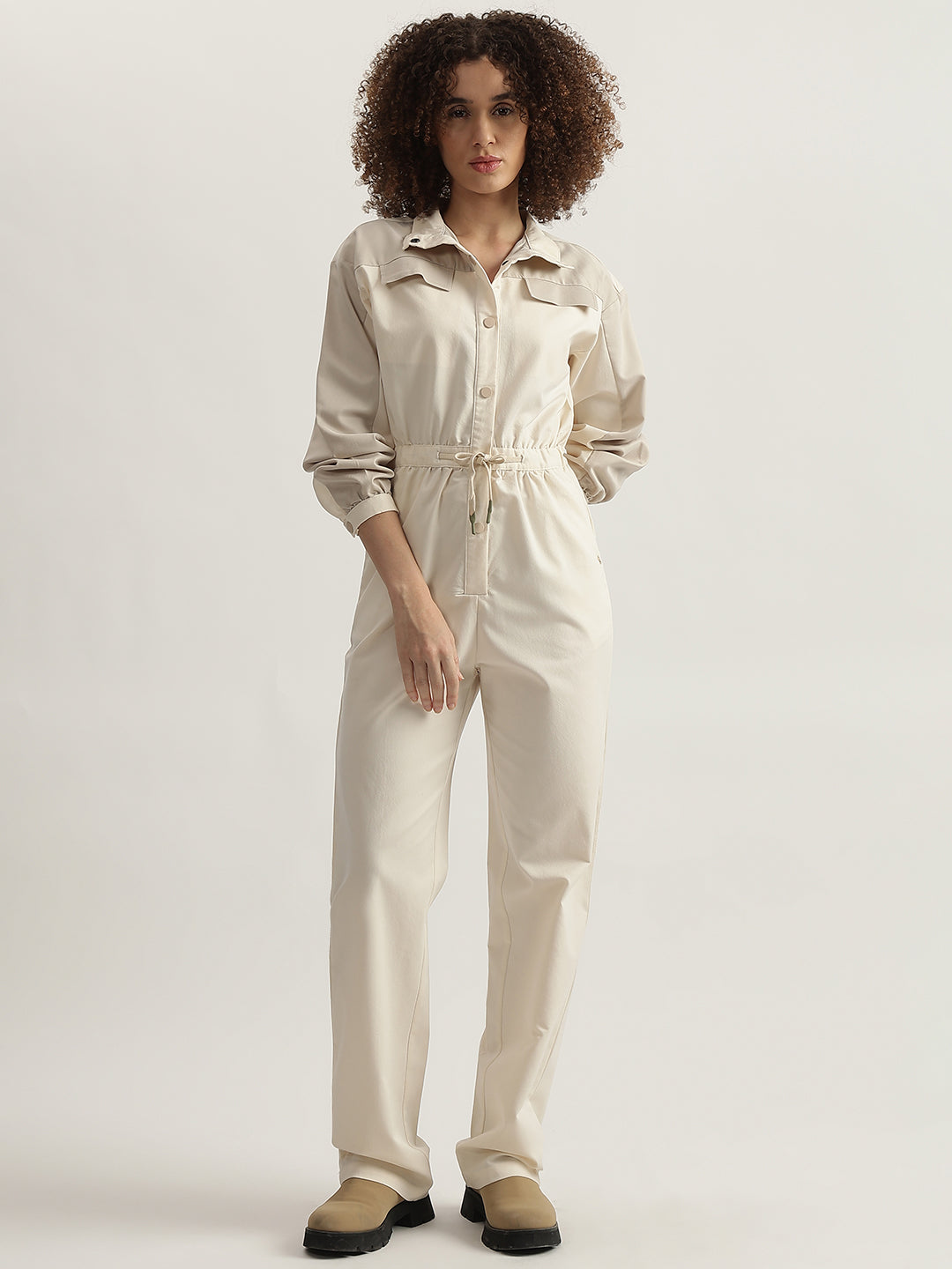 Iconic Women Beige Solid High Neck Full Sleeves Jumpsuit