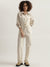 Iconic Women Beige Solid High Neck Full Sleeves Jumpsuit